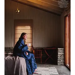 A moment of peace in one of the guest rooms at Shakti Prana. The design emphasizes natural light and materials, with large windows opening up to the mountain air, creating a space that feels both luxurious and deeply connected to its environment.