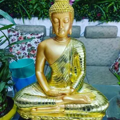 For a touch of luxury, I offer this stunning golden Buddha statue. It's an eye-catching decor piece that brings warmth and tranquility.