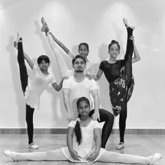 My advanced ballet students showcasing their flexibility and strength in a group pose. This demonstrates the results of dedicated training and practice in my classes.