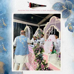A guest raises a glass at a beautiful floral-themed bar during a wedding reception at The Leela Palace. We love creating these picture-perfect moments.