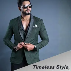 A full look at the textured green designer suit, buttoned up to show its perfect fit. The pocket square adds a final touch of class to this elegant ensemble.
