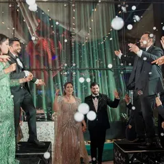 When the couple's energy is electric, their entry should be too. I designed this fun flashmob entry where friends and family danced on platforms, surrounded by bubbles, to bring in the happy couple.
