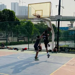 A contested jump shot near the basket shows the competitive intensity of our training sessions.