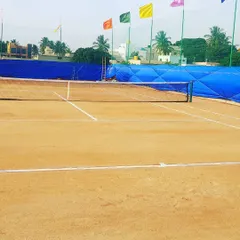 Here is a clear view of our tournament-ready clay court on a bright day. We keep the lines sharp and the surface perfectly prepared, so you get a consistent and professional playing experience every single time.