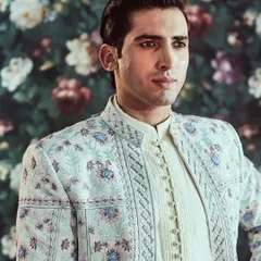 The intricate Resham embroidery on this jacket showcases our commitment to detailed craftsmanship, creating a piece that is both modern and timeless.