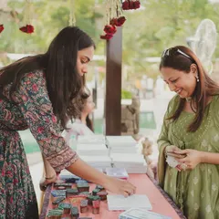 Guests enjoying the various interactive stalls at the Mehendi. Creating different zones for activities ensures there is always something new for people to discover and enjoy.