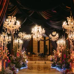 A masquerade sangeet at the St. Regis Mumbai, where royal elegance met a touch of mystery. The entrance, draped in deep velvets and lit by magnificent chandeliers, set the stage for a night of magic, music, and dancing.