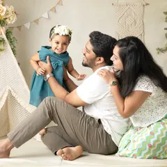 Celebrating a third birthday in style with a boho-themed family shoot. The teepee and natural elements create a warm and whimsical atmosphere.