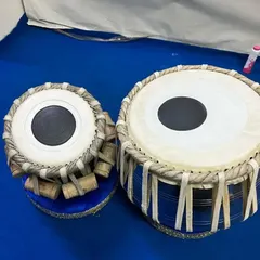 This professional tabla set by features a striking blue wooden bayan. We check the tonal quality of every instrument to ensure it meets the needs of both students and professional performers.