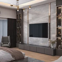 This bedroom features a full-wall media unit with a marble-finish backdrop and integrated shelving. The dark wood tones and gold accents create a rich, luxurious feel, providing both entertainment and storage.