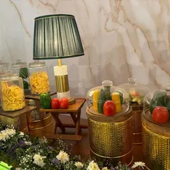 Our Italian pasta bar setup, featuring jars of different pasta types and fresh vegetables as decor. It's a visual promise of the authentic meal to come.