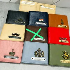 More examples of the croc-textured wallets in various colors like cream, blue, pink, and green, each with a unique name and charm combination.