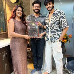 Celebrating another student's journey from beginner to professional artist. Holding his certificate, he is now equipped with the skills to create stunning makeup and hair looks for his own clients.