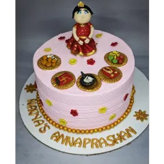 A special cake for an Annaprashan ceremony, which marks a baby's first taste of solid food. This fresh pineapple cake is decorated with traditional and symbolic fondant toppers.