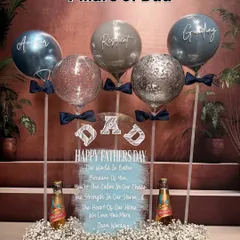 The "Pillars of Dad" arrangement is a complete gift set. It includes the personalized acrylic board and balloons, plus his favorite beers, making it a truly special and customized Father's Day surprise.