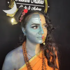 A side profile of the Ardhanarishvara (Shiva-Parvati) look. This demonstrates advanced techniques in body painting and character makeup.