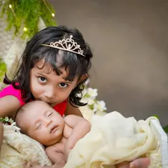 A princess and her new, tiny subject. I love creating these storybook moments, where a big sister's love and protection for her new sibling shines through.
