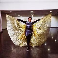 Posing with the golden belly wings before our performance at the Landmark Group's Family Fiesta. We handle all aspects of the performance, including sourcing unique costumes and props to fit the theme.