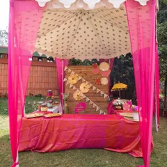 A vibrant pink food stall, perfect for serving chaat or other snacks at a festive event. The decor is bright, colorful, and inviting.