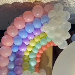 A beautiful pastel rainbow balloon arch, a popular and cheerful choice for baby showers and first birthdays.