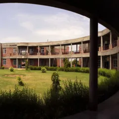 The serene central courtyard of the Vidyagram school. This archival photo shows our long-held belief in the importance of open, green spaces for creating a calm and inviting atmosphere for learning.