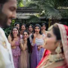 The bridesmaids' priceless reactions as they watch the couple's first look. A perfect candid moment full of surprise and joy.