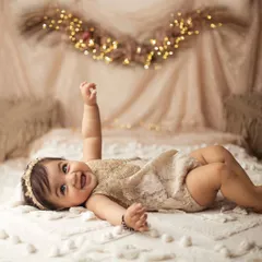 Sometimes the simplest moments are the most beautiful. This little sweetheart's happy giggle during her boho-themed sitter session is just pure love at first sight.