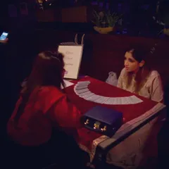 This is where the magic happens. A quiet moment during a private tarot reading, creating a safe space for my client to explore their questions and connect with the universe's guidance. Each session is a unique journey.