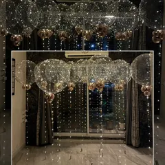 A setup straight out of a fairytale. This collage shows how our floating bubble balloons, filled with tiny lights, can completely transform an indoor space for a 24th birthday.