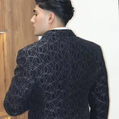 The back view of this patterned tuxedo jacket shows the precision of the fit and the quality of the fabric. Every detail is crafted to ensure you look sharp from every angle.