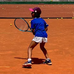 Always prepared. This is the ready position of a future champion, focused and waiting for the ball. We instill this level of concentration and preparation in all our young players from day one.