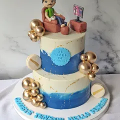 Even personal celebrations like retirements can call for a showstopper. This two-tier cake adds a level of grandeur to the party, with its beautiful blue wave design and clusters of golden spheres.