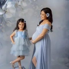 A sweet moment between mother and daughter. I love capturing the bond between a mom and her child as they anticipate the new arrival.