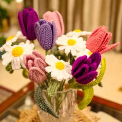A beautiful mixed bouquet of my crochet creations. It features tulips in various shades of pink and purple, along with classic white daisies.