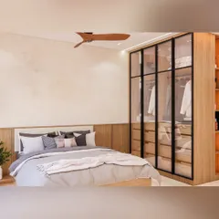 A bedroom at Prestige Waterford designed with intent. This space features a modern glass-door wardrobe, a neutral color palette, and warm wood tones, creating a beautifully balanced and functional room.