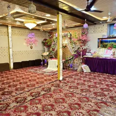 This is a glimpse of our banquet hall, fully decorated and ready for a special occasion. I designed the space to be intimate and elegant, perfect for everything from a Nikah ceremony to a family Jaman, with traditional floor seating that brings everyone together.