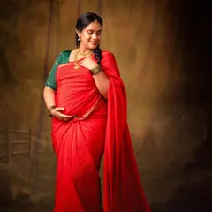 The rich red of the saree and her joyful smile make this portrait so special. I love helping moms-to-be create the traditional maternity look they've been dreaming of.