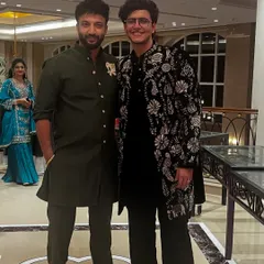 A custom black velvet sherwani with intricate floral embroidery designed for YouTuber Triggered Insaan. This piece was part of his wedding collection, showcasing a blend of traditional motifs and modern elegance.