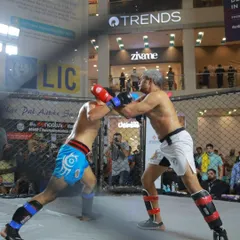 Our founder and head coach, Ashwin Naidu, leads from the front, not the sidelines. This is him competing in the 6th Bengaluru Open MMA Championship, demonstrating the effectiveness of our mixed martial arts training program inside the cage.