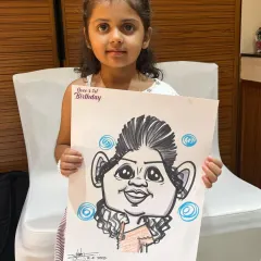 A young guest at Ovee's birthday party with her sweet caricature. It's always a joy to draw for children and see their happy faces.