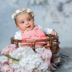 This little one was so full of personality. Seated comfortably in a basket prop, she looked around the studio with curiosity, allowing me to capture her bright and engaging expression.