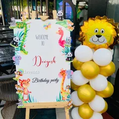 A cute welcome sign for a jungle-themed party, decorated with little animals.