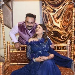 A romantic shot of the couple on a traditional swing (jhoola), a popular element in baby shower celebrations.