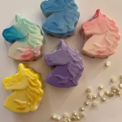 A collection of colorful unicorn soaps, individually wrapped and ready to make bathtime fun. These are a popular choice for custom party favors.