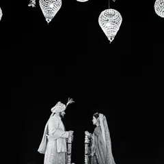 A powerful black and white silhouette of the couple during their wedding ceremony. The dramatic lighting and composition create a timeless and artistic image of their union.