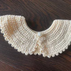 Another shot of the beautiful off-white detachable collar, ready to add a touch of handmade charm to any outfit.