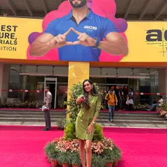 Posing at the entrance of the ACETECH exhibition at the Bangalore International Exhibition Centre. Hosting this event means being the face of a massive industry gathering.