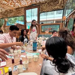A group of participants at our Jesmonite workshop in Mumbai, fully engaged in mixing their colors. It's a hands-on process that's super satisfying.