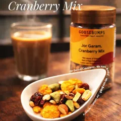 My Jor Garam Cranberry Mix is a delightful trail mix with a blend of textures and flavours. It combines the sweetness of cranberries with the savoury crunch of nuts and puffed rice, making it a satisfying snack for any time of day.