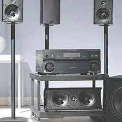 A full Definitive Technology ProCinema setup. This system combines satellite speakers, a center channel, and a subwoofer to create a complete, high-definition surround sound experience.